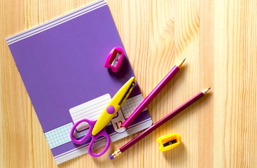 Back to school. school supplies on a wooden Board.