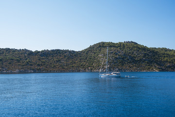 Wall Mural - yacht on bay and castle in Kekova, near ruins of the ancient city on the Kekova island, Turkey