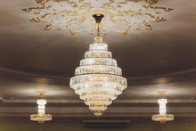 Close-up Of A Beautiful Crystal Chandelier Beautiful Chandelier. Luxury Expensive Chandelier Hanging Under Ceiling.