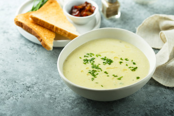 Poster - Homemade creamy asparagus soup in a white bowl