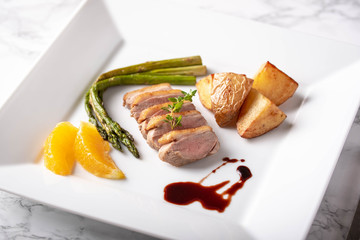 Wall Mural - sliced roasted duck with red wine sauce and orange