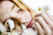 Close Up Of Girl Holding Daisy Flower
