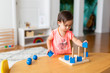 © KCULP - Toddler Girl Playing and Exploring with Montessori Lessons