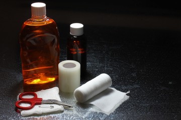 Bottles of disinfectant,ointment,tape and bandages are crucial items to clean and care for wounds.