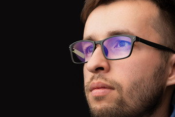 Fototapete - Young man looking with futuristic smart high tech glasses