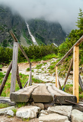 Wooden bridge over mountain river