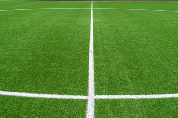 Wall Mural - Green artificial grass soccer sports field with white stripe line