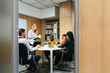 © MyMicrostock/Stocksy - Diverse people working in stylish office