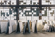 © Raymond Forbes LLC/Stocksy - Rack of Stone Slabs against Wall