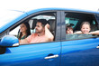 © Pixel-Shot - Happy family travelling by car