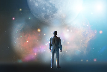 Wall Mural - man stands watching with wonder the universe and amazement galaxy fill the night sky 3d render