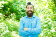 © be free - Protect nature eco movement. Eco lifestyle concept. Explore nature. Save environment. Eco activist. Man handsome bearded guy in sunny forest. United with environment. Go green think fresh. Earth day