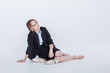 © Air_Lady - Woman in alcohol intoxication after corporate party. Girl wearing unbuttoned business jacket and takes off shoes from fatigue. Isolated white background