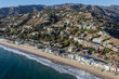 Aerial view of Malibu beaches, homes and hillsides north of Santa Monica on Pacific Coast Highway in Los Angeles County, California.  