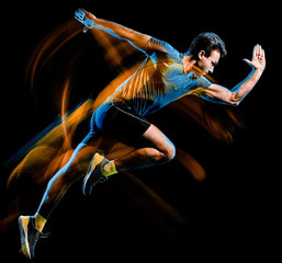Wall Mural - one caucasian runner running jogger jogging man light painting speed effect isolated on black backgr