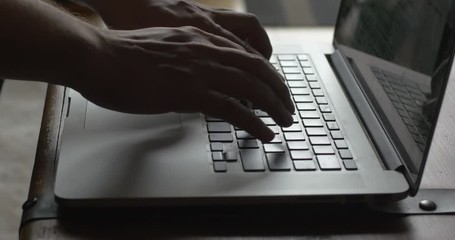 Hands Typing Email on Laptop Keyboard
