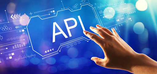 API concept with hand pressing a button on a technology screen