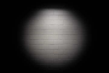 Spotlight on white wall 