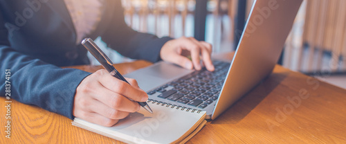 Business Women Hand Are Taking Notes On Paper With A Black Pen