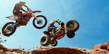 ATV Rider In The Action With Motocross  Rider.