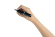 © asiandelight - close up of hand holding black magic marker pen ready to writing something isolated on white background with copy space, studio shot, back view
