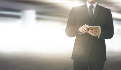  Business man using smartphone in hand