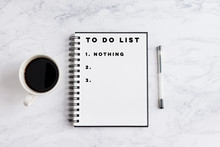To Do List Nothing Writing On Notebook. Notebook On Desk With Coffee Cup And A Pen.