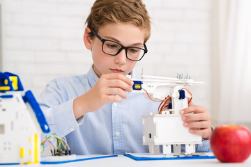 Poster - Smart boy making diy robot at stem lab