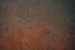 Close up of old, dirty and corroded metal plate with rusty surface, abstract background image of grungy, filthy and oxidized iron wall showing corrosion and chemical destruction which needs removal