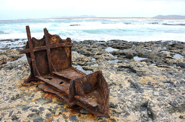 Wall Mural - Rusty Anchor on a Volcanic Rocky Beach of Fuerteventura, Canary Islands