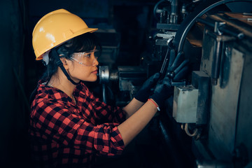 Asian beuatiful woman working with machine in the factory engineer and working woman concept or woman day