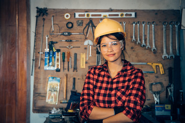 Asian beuatiful woman working with machine in the factory engineer and working woman concept or woman day