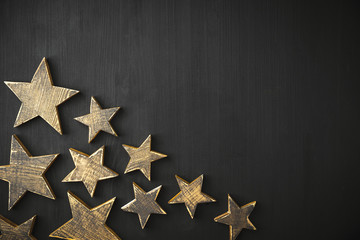 Wall Mural - Golden Christmas Stars  Rustic on a dark background, Copyspace, handmade