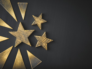 Wall Mural - Golden Christmas Stars  Rustic on a dark background, Copyspace, handmade