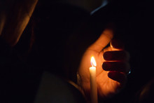 Blurred Image For Background Of Hand With Candle.