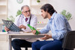 © Elnur - Young male alcoholic visiting old doctor