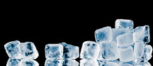 Pieces Of Frosty Ice Cubes On Black Reflective Surface Background.