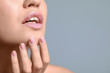 © Pixel-Shot - Young woman with beautiful lips on color background, closeup