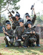© JackF - Portrait of paintball players wearing uniform and holding guns ready for playing