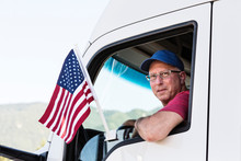 Portrait Of Truck Driver Looking Through Truck Window
