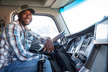Portrait Of Truck Driver Sitting In Truck