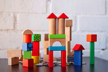Construction Made By A Child Of Wooden Building Blocks Of Colors.