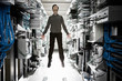 © Mint Images - Technician jumping in computer server room