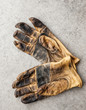 © Mint Images - Overhead view of pair of gloves in workshop