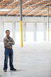 © Mint Images - Portrait of architect standing in warehouse