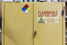 Safety Sign On Metal Cabinet In Workshop