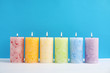 canvas print picture - Alight scented wax candles on color background