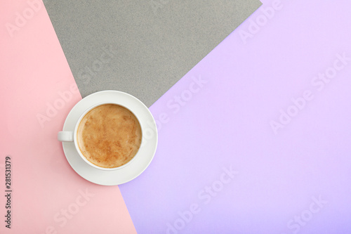 Fotografía Cup of coffee on color background, top view. Space for text