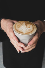 Midsection Of Woman Holding Coffee Mug
