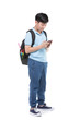 © sirikorn - Student boy with backpack and stationery holding cell phone .